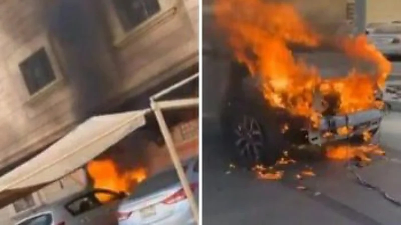مواطن يسحب سيارة  مشتعلة بعد اندلاع حريق في مواقف السيارات أمام منزل بالدمام  " فيديو "