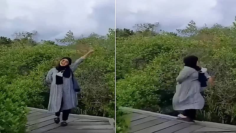 موقف محرج لفتاة أثناء تصويرها وسط الأشجار .. فيديو