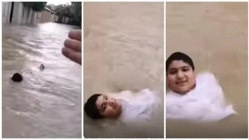 بالفيديو.. طفل يسبح على ظهره في سيول الإمارات