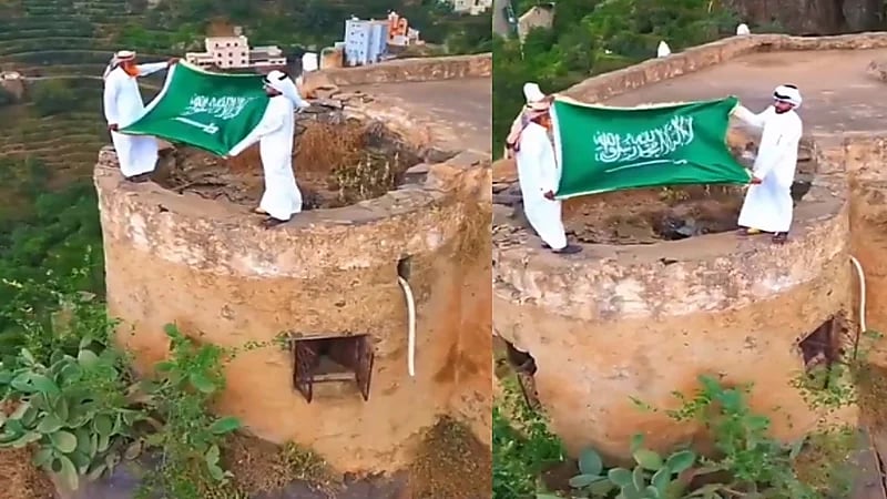 فيديو..مواطنان يحتفلان بيوم العلم على علو شاهق