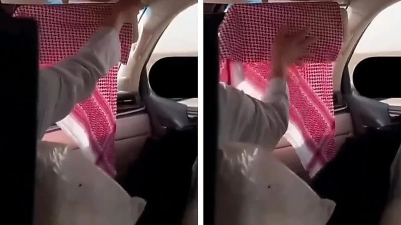 رجل يستخدم الشماغ لحماية زوجته من أشعة الشمس ..فيديو