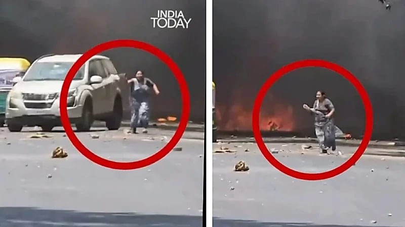 أم هندية تفشل في إنقاذ طفلها من نيران الطائرة المنكوبة .. فيديو