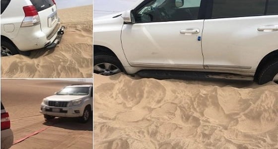 بالصور.. فريق غوث يخرج سيارة عالقة في الرمال في المرشدية